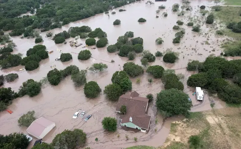 Flooded river in Kerrville, Texas showing significant flood waters