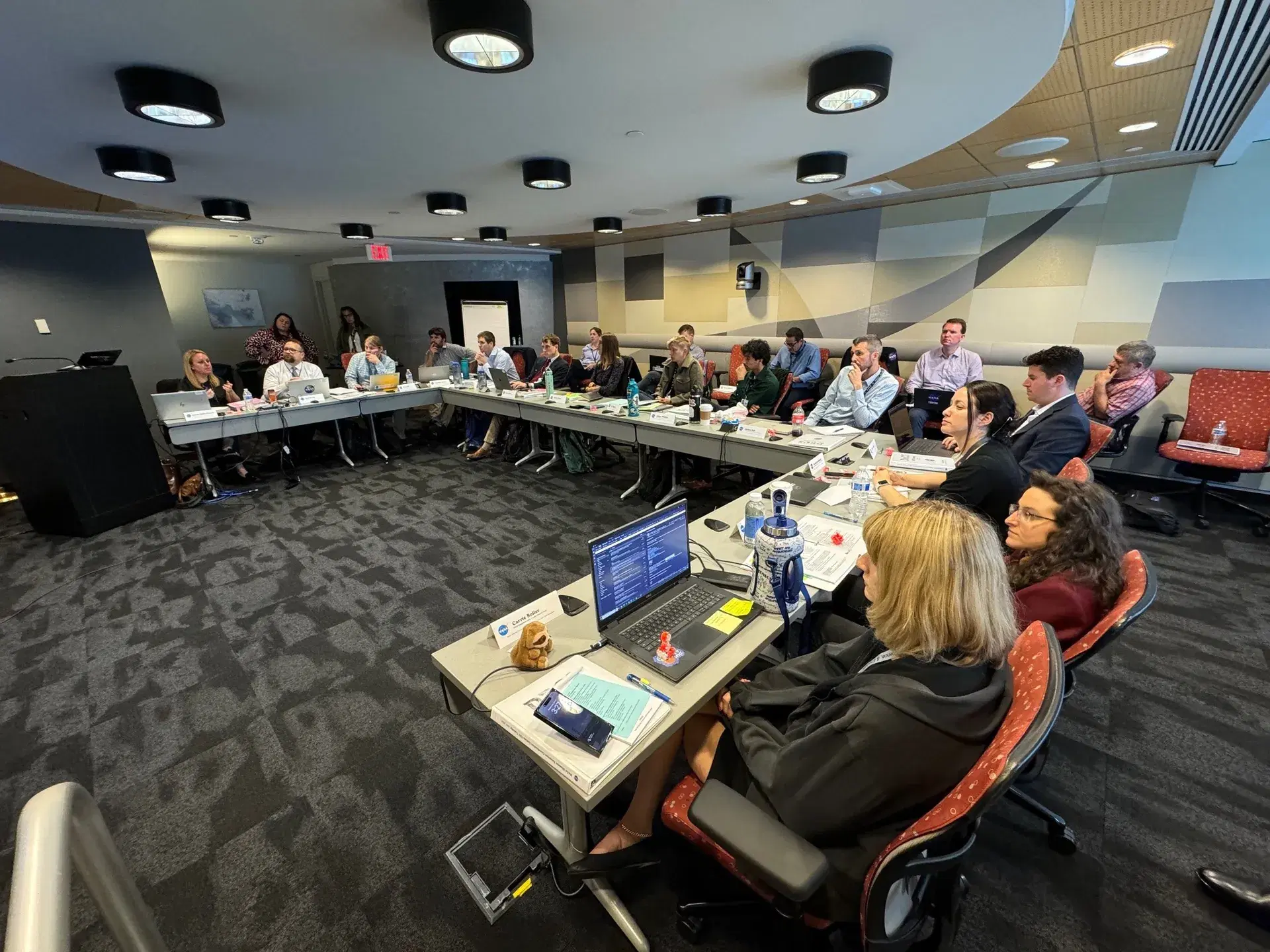 Participants seated around a large conference table during a training session.