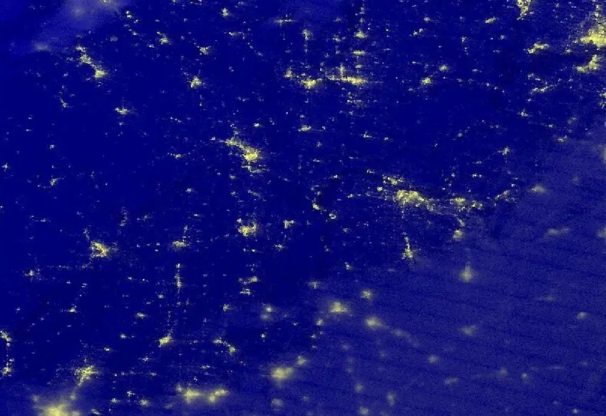 Black Marble nighttime imagery over Missouri, Arkansas, Kentucky and Tennessee, with city lights in yellow against blue cloud cover