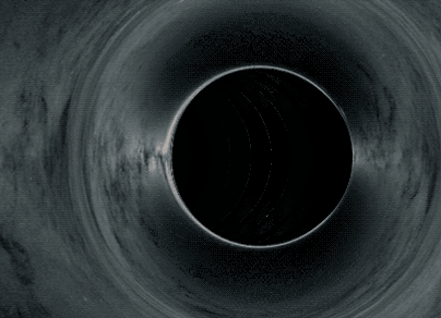 Simulation of a black hole distorting space around it.