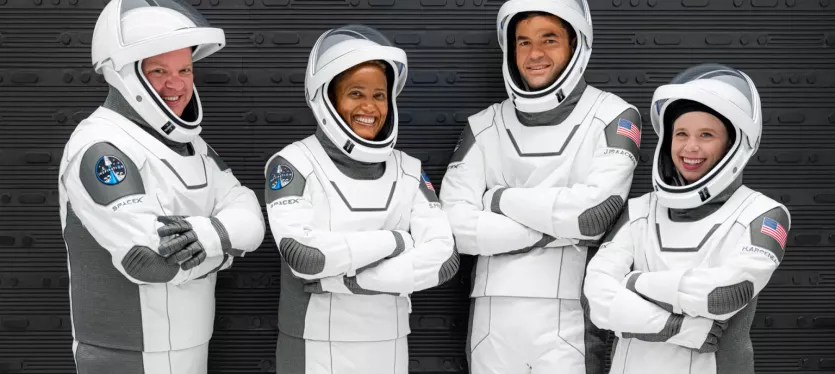 Astronauts from the Inspiration-4 commercial mission -- Christopher Sembroski, Sian Proctor, Jared Isaacman, and  Hayley Arceneaux -- pose in their spacesuits.