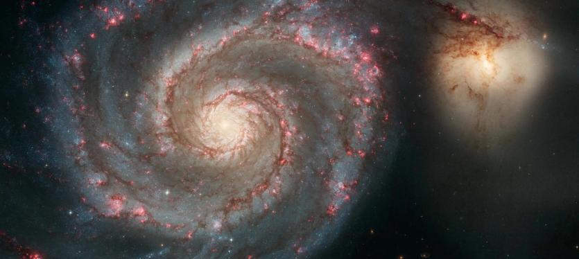 The Whirlpool Galaxy and smaller galaxy companion NGC 5195, as imaged by the Hubble Space Telescope.