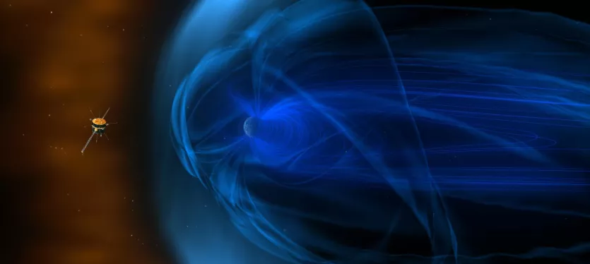 Artist's impression of NASA's Wind spacecraft observing how the solar wind interacts with Earth's magnetic field, shown as a glowing blue veil around the planet.