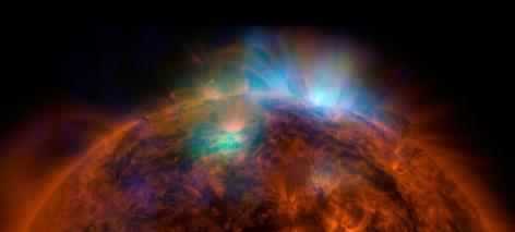 X-rays stream off the sun in this first picture of the sun, overlaid on a picture taken by NASA Solar Dynamics Observatory SDO, taken by NASA NuSTAR.