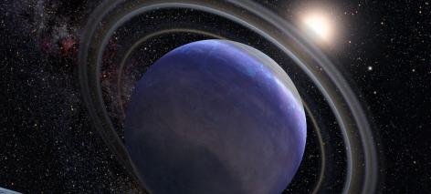 Artist's impression of a blue exoplanet with rings.