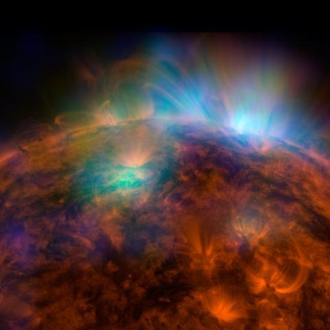 X-rays stream off the sun in this first picture of the sun, overlaid on a picture taken by NASA Solar Dynamics Observatory SDO, taken by NASA NuSTAR.