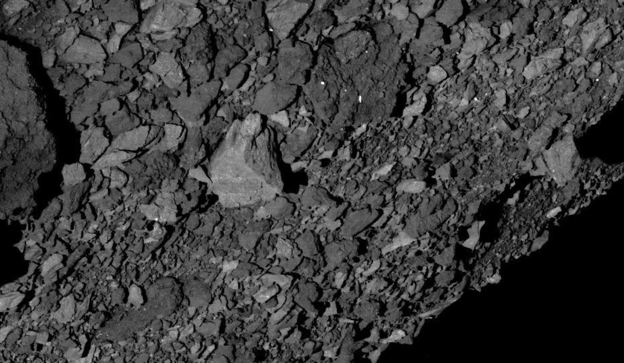 The view across asteroid Bennu’s southern hemisphere and into space, demonstrating the number and distribution of boulders across Bennu’s surface.