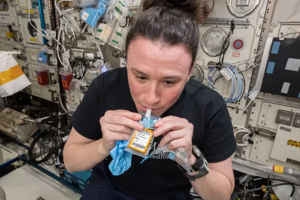 NASA astronaut Serena Auñón-Chancellor provides a saliva sample on the International Space Station.