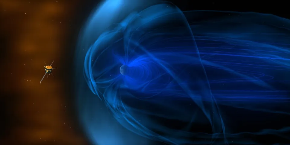 Artist's impression of NASA's Wind spacecraft observing how the solar wind interacts with Earth's magnetic field, shown as a glowing blue veil around the planet.